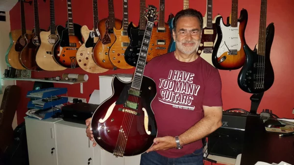 Nick Weakley with his new left handed Port Wine Conti Entrada Guitar