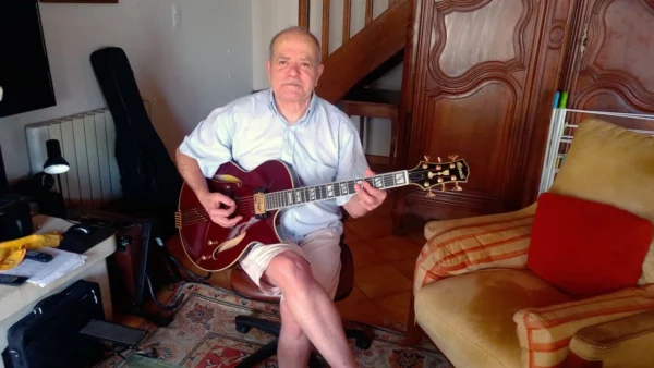 Alex takes a moment to show his new Port Wine Conti Entrada archtop jazz guitar featuring the exquisite gold finger tailpiece.
