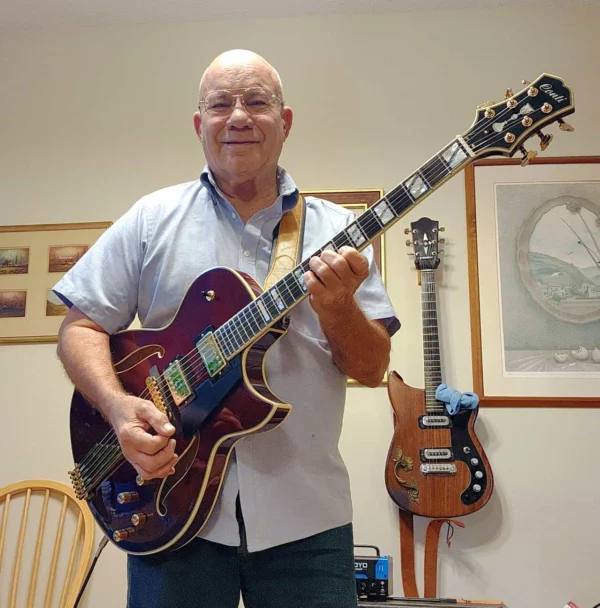 Tim Chandler with his beautiful double pickup port wine Conti Entrada archtop jazz guitar